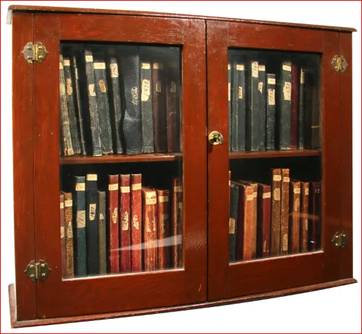The original diary booklets, kept in a family cabinet.